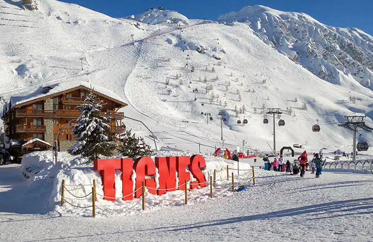 Resort sign for Tignes on a ski slope